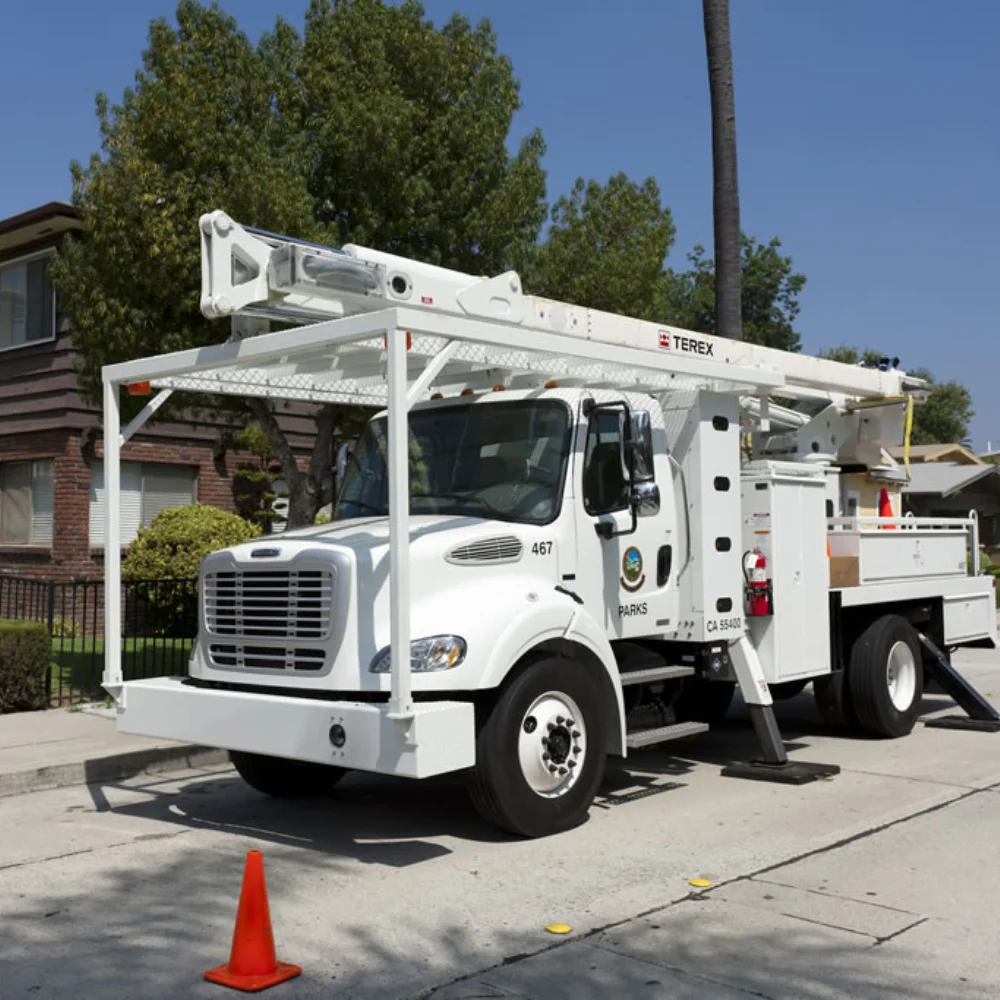 Parks Department Freightliner truck equipped with a TEREX aerial platform parked in a residential area